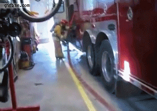 1333387254_fireman_swept_by_hose.gif