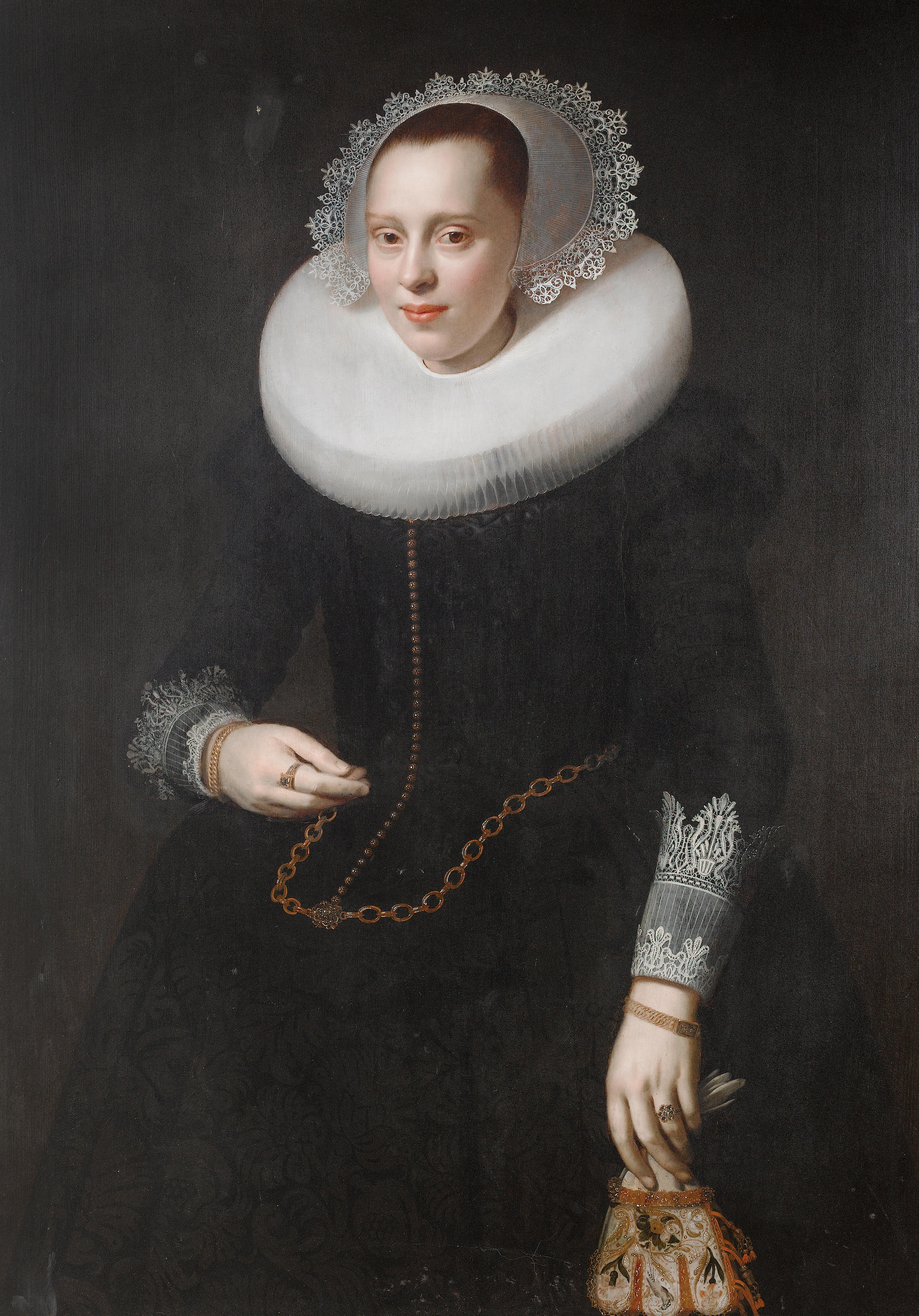 27 Nicolaes Elias, called Pickenoy (Amsterdam circa 1588-circa 1655) Portrait of a lady, standing, three-quarter-length, in a black dress and white collar, holding a glove.jpg