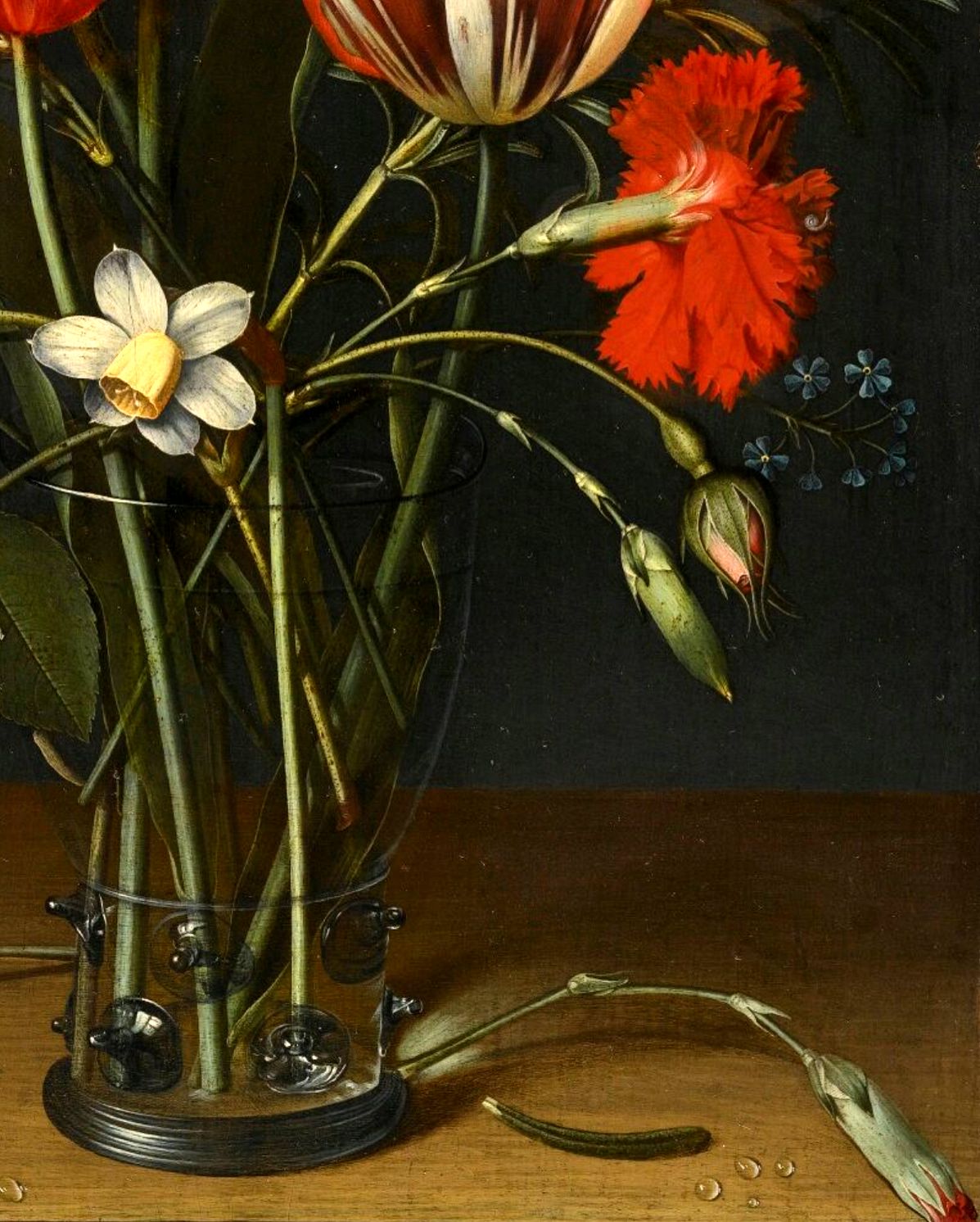 Jacob_van_Hulsdonck_-_Still_life_of_tulips,_carnations,_a_rose_and_other_flowers_in_a_glass_beaker_resting_on_a_woode.jpg